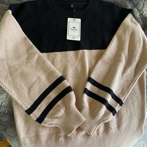 Women’s size M black and cream sweater. Brand new purchased from Amazon.